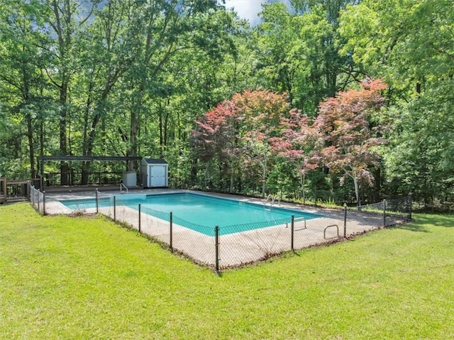 view of swimming pool featuring a storage unit and an outdoor structure
