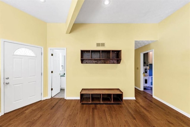 entryway with wood finished floors, baseboards, and recessed lighting