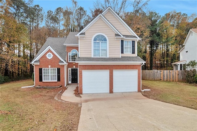 front facade featuring a front yard and a garage