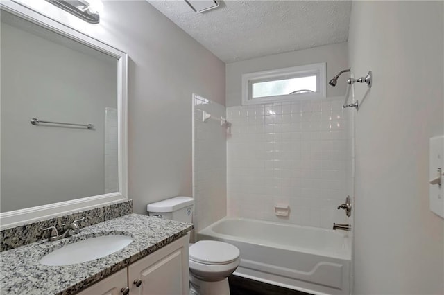 full bathroom featuring vanity, toilet, a textured ceiling, and bathtub / shower combination