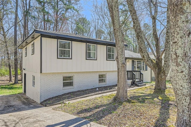 view of side of property featuring brick siding