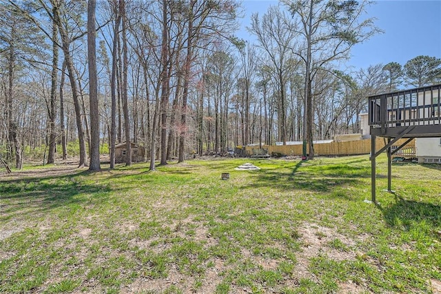 view of yard with stairs and a deck