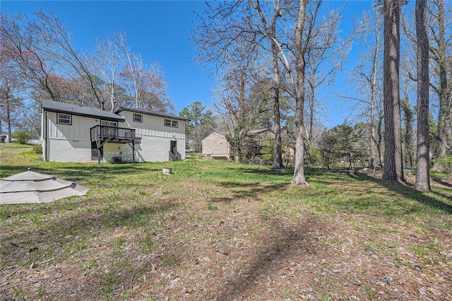 view of yard with a wooden deck