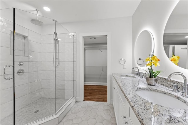 bathroom with vanity, tile patterned floors, and walk in shower