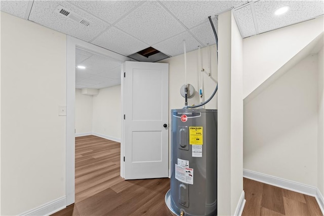 utility room featuring water heater