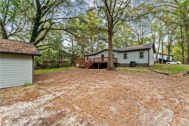 view of yard with a wooden deck and cooling unit