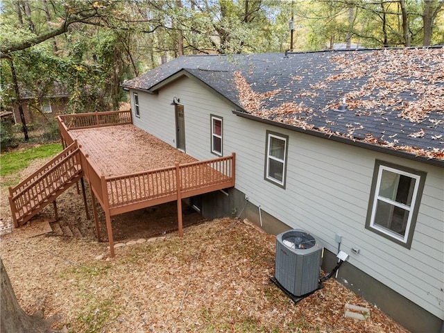 exterior space with a wooden deck and central AC