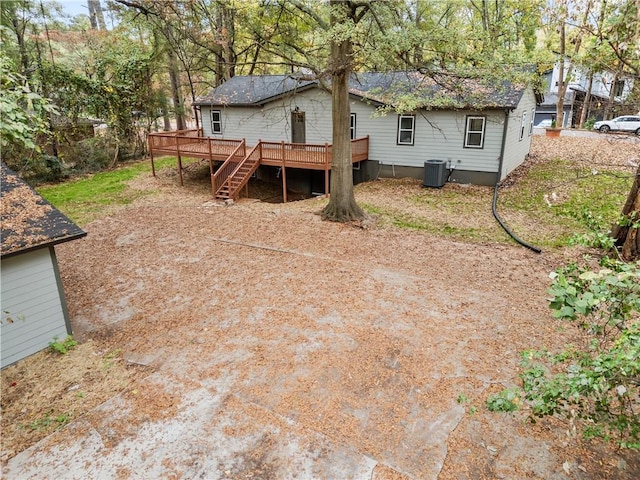 back of house featuring cooling unit and a deck