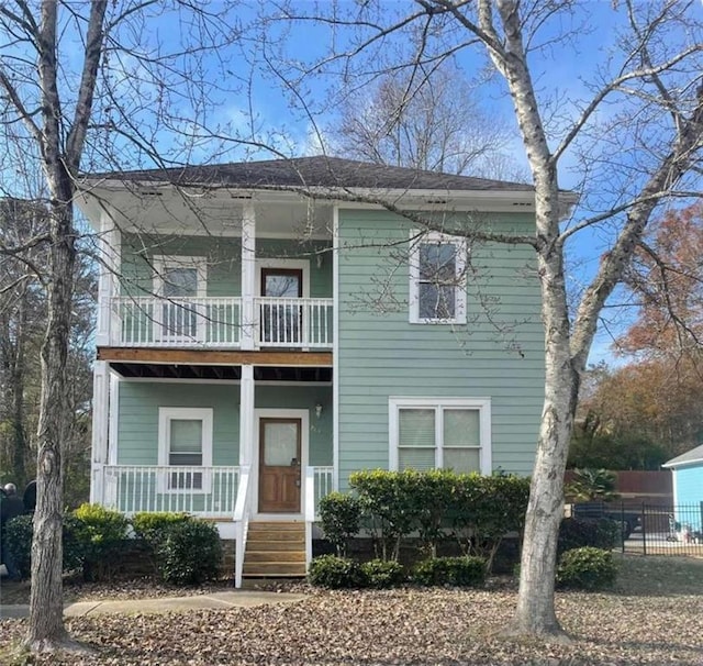 view of front of property featuring a balcony