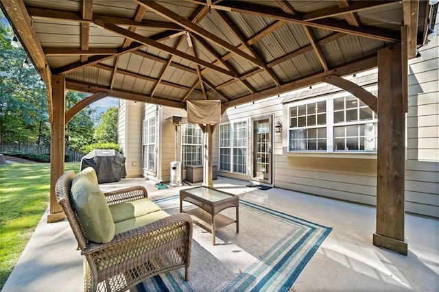 view of patio with area for grilling, a gazebo, and an outdoor hangout area