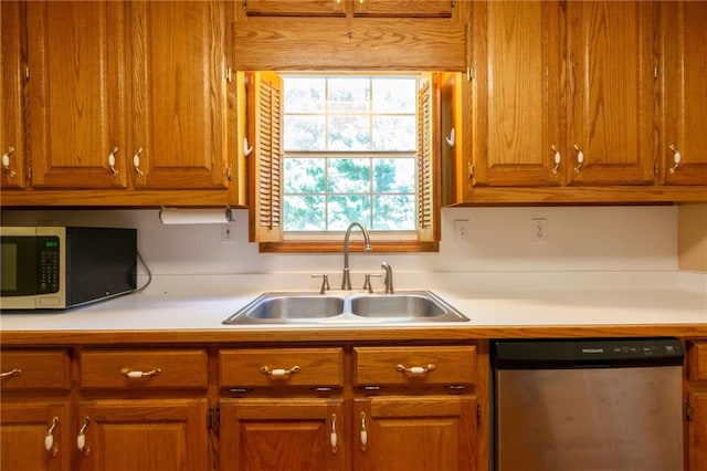 5425 Windswept Trce, Sugar Hill, GA 30518 - kitchen featuring appliances with stainless steel finishes, a sink, light countertops, and brown cabinets