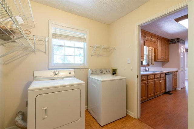5425 Windswept Trce, Sugar Hill, GA 30518 - washroom with washer and dryer, healthy amount of natural light, a textured ceiling, and parquet floors