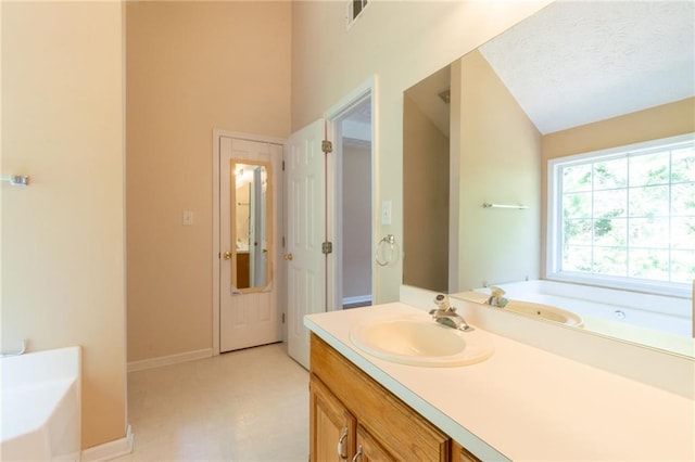 5425 Windswept Trce, Sugar Hill, GA 30518 - bathroom featuring a bath, vanity, baseboards, and tile patterned floors
