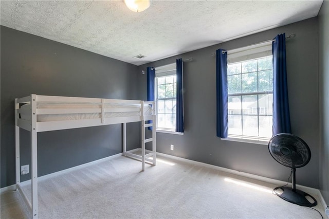 5425 Windswept Trce, Sugar Hill, GA 30518 - unfurnished bedroom featuring carpet, a textured ceiling, and baseboards