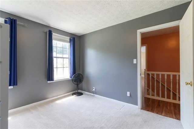 5425 Windswept Trce, Sugar Hill, GA 30518 - carpeted spare room featuring a textured ceiling and baseboards