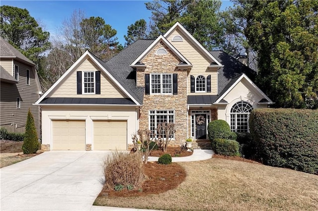 view of front of property with driveway, a standing seam roof, a garage, stone siding, and metal roof