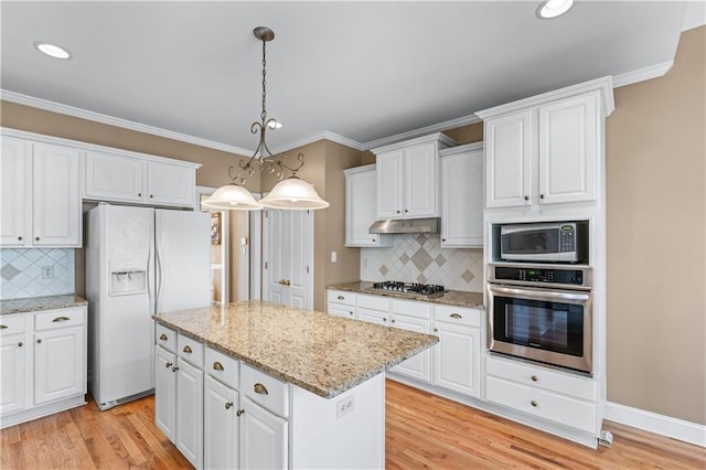 kitchen featuring under cabinet range hood, a center island, appliances with stainless steel finishes, white cabinets, and light wood finished floors