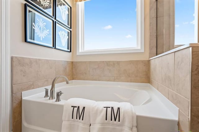 bathroom featuring a washtub