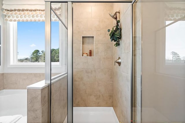 bathroom with a shower with shower door