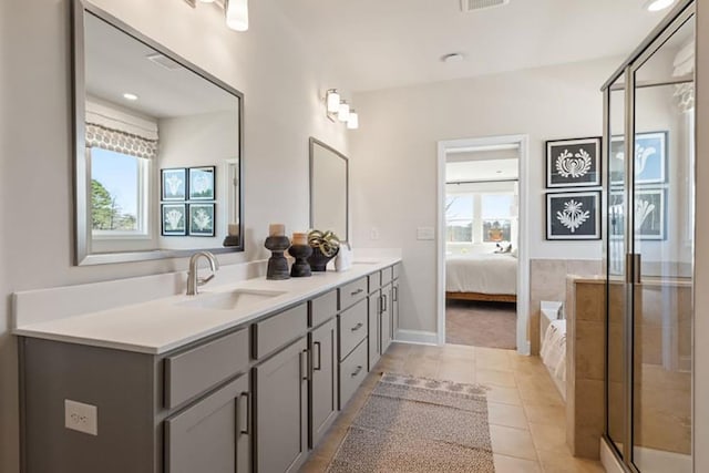 bathroom featuring shower with separate bathtub, vanity, and tile patterned flooring