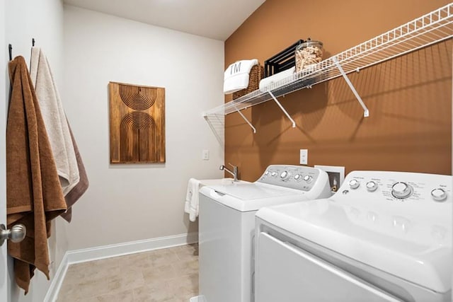 1446 Auburn Glen Rd, Dacula, GA 30019 - laundry area with washer and clothes dryer and baseboards