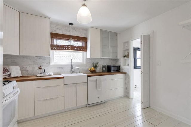 1631 Dresden Dr NE, Brookhaven, GA 30319 - kitchen with white appliances, decorative backsplash, light wood-type flooring, wooden counters, and decorative light fixtures