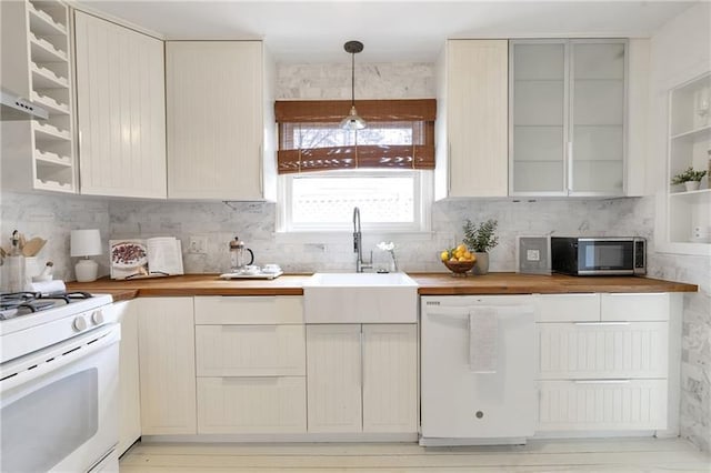 1631 Dresden Dr NE, Brookhaven, GA 30319 - kitchen featuring white appliances, wooden counters, backsplash, hanging light fixtures, and glass insert cabinets