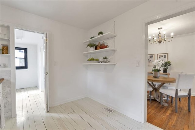 1631 Dresden Dr NE, Brookhaven, GA 30319 - dining space featuring a chandelier and light wood-style flooring