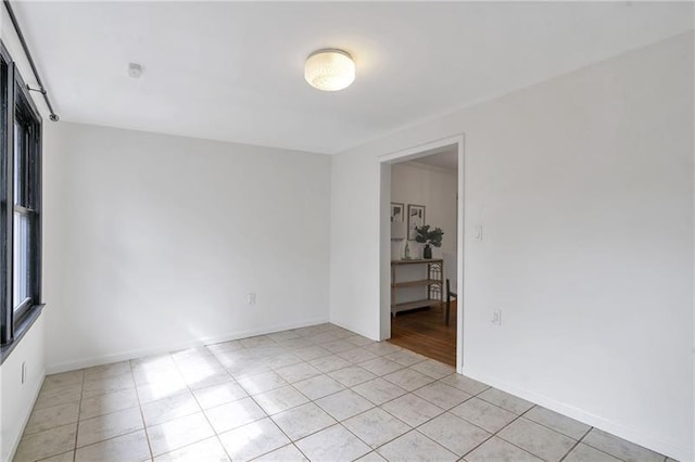 1631 Dresden Dr NE, Brookhaven, GA 30319 - empty room featuring light tile patterned flooring and baseboards