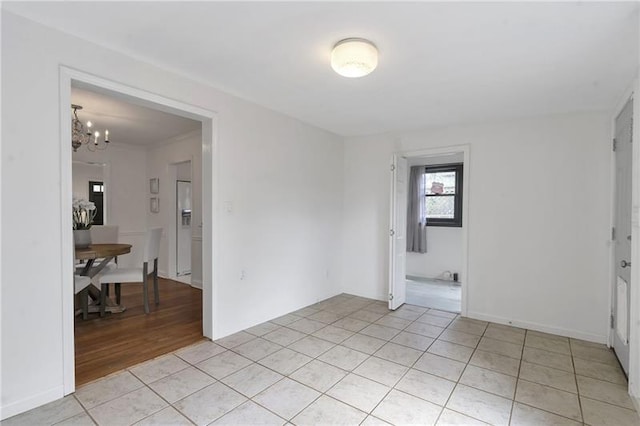 1631 Dresden Dr NE, Brookhaven, GA 30319 - unfurnished room with a chandelier and light tile patterned floors