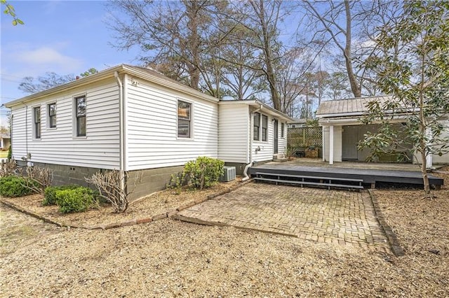 1631 Dresden Dr NE, Brookhaven, GA 30319 - view of side of home with a deck, a patio, and an outdoor structure
