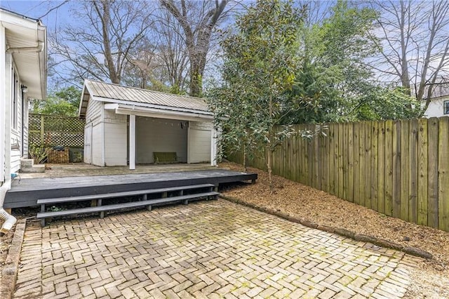 1631 Dresden Dr NE, Brookhaven, GA 30319 - fenced backyard featuring a wooden deck and an outdoor structure