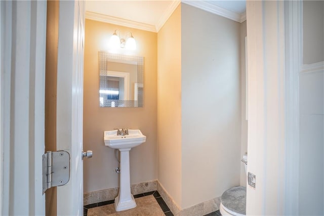 1137 Fortress Ave SW, Atlanta, GA 30315 - half bathroom with tile patterned flooring, toilet, baseboards, and ornamental molding