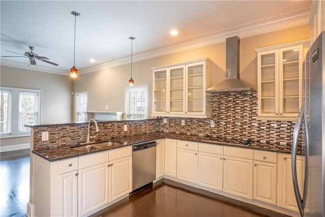 1137 Fortress Ave SW, Atlanta, GA 30315 - kitchen featuring a sink, a peninsula, appliances with stainless steel finishes, wall chimney exhaust hood, and a healthy amount of sunlight