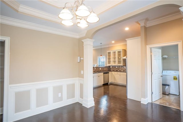 1137 Fortress Ave SW, Atlanta, GA 30315 - dining area featuring a wainscoted wall, washer / clothes dryer, dark wood-style floors, and arched walkways