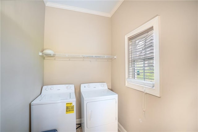 1137 Fortress Ave SW, Atlanta, GA 30315 - clothes washing area featuring washer and dryer, baseboards, ornamental molding, and laundry area