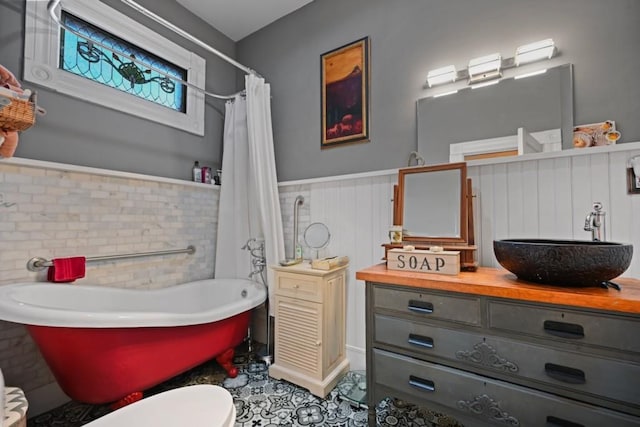 full bathroom featuring vanity, toilet, and plus walk in shower