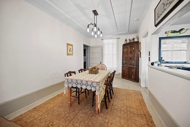 dining space with crown molding