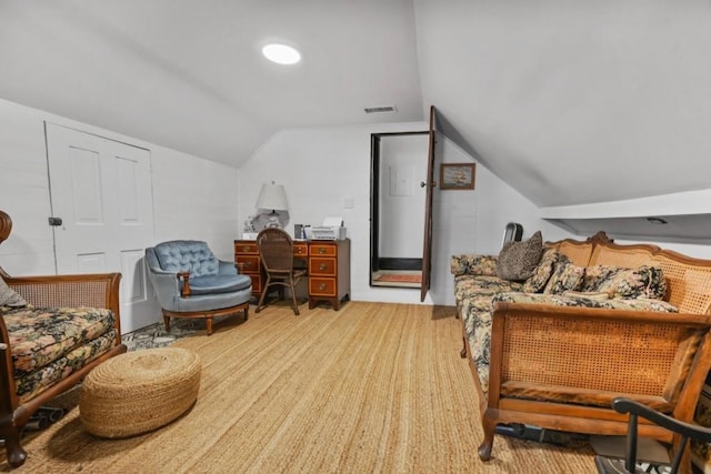 sitting room featuring lofted ceiling