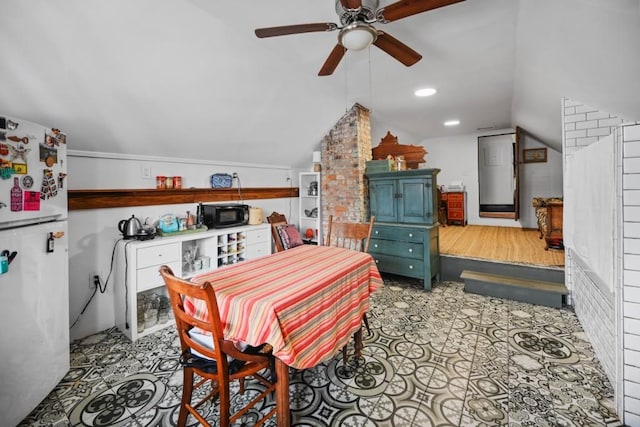 dining space with lofted ceiling and ceiling fan