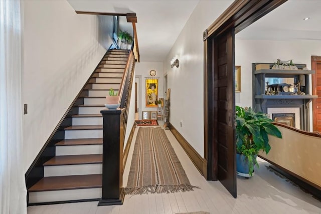 stairs featuring wood-type flooring