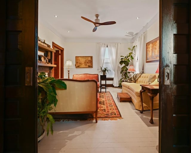 sitting room with light hardwood / wood-style flooring and ceiling fan