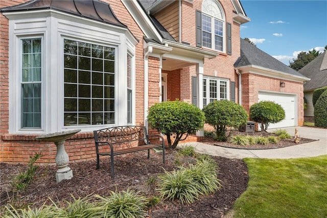 exterior space featuring a lawn and a garage