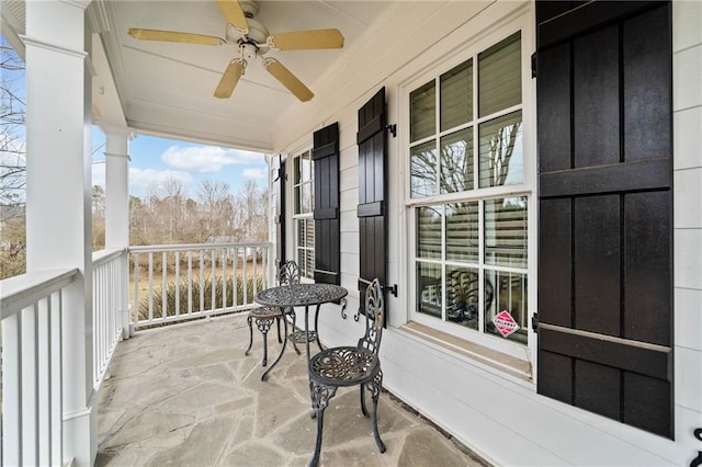 balcony featuring a ceiling fan and covered porch