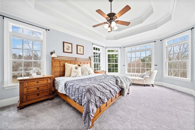 bedroom featuring carpet, crown molding, and multiple windows