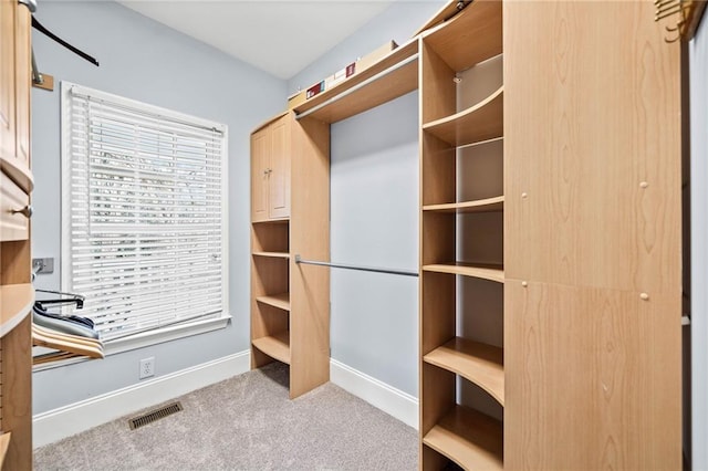 walk in closet with carpet floors and visible vents