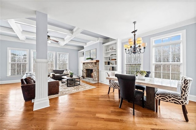dining room featuring a healthy amount of sunlight, light wood finished floors, and baseboards
