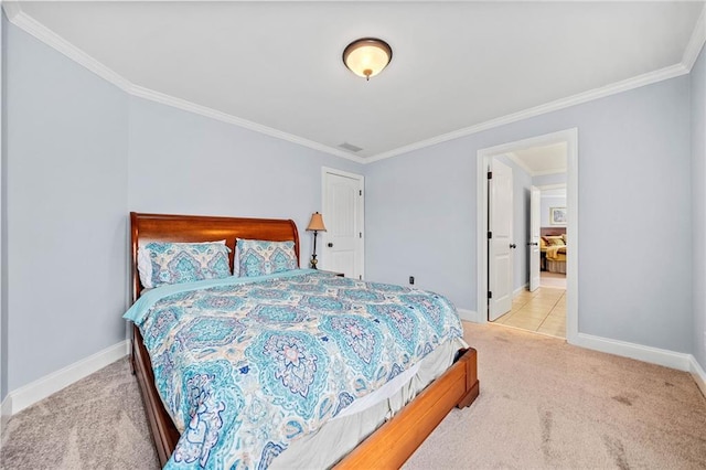 carpeted bedroom featuring baseboards and ornamental molding