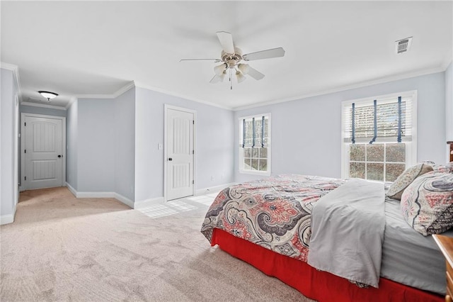 bedroom with carpet, visible vents, baseboards, and ornamental molding
