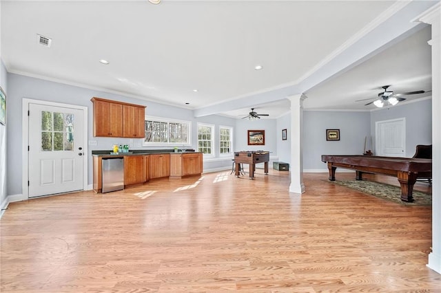 kitchen with light wood-style floors, visible vents, ceiling fan, and decorative columns